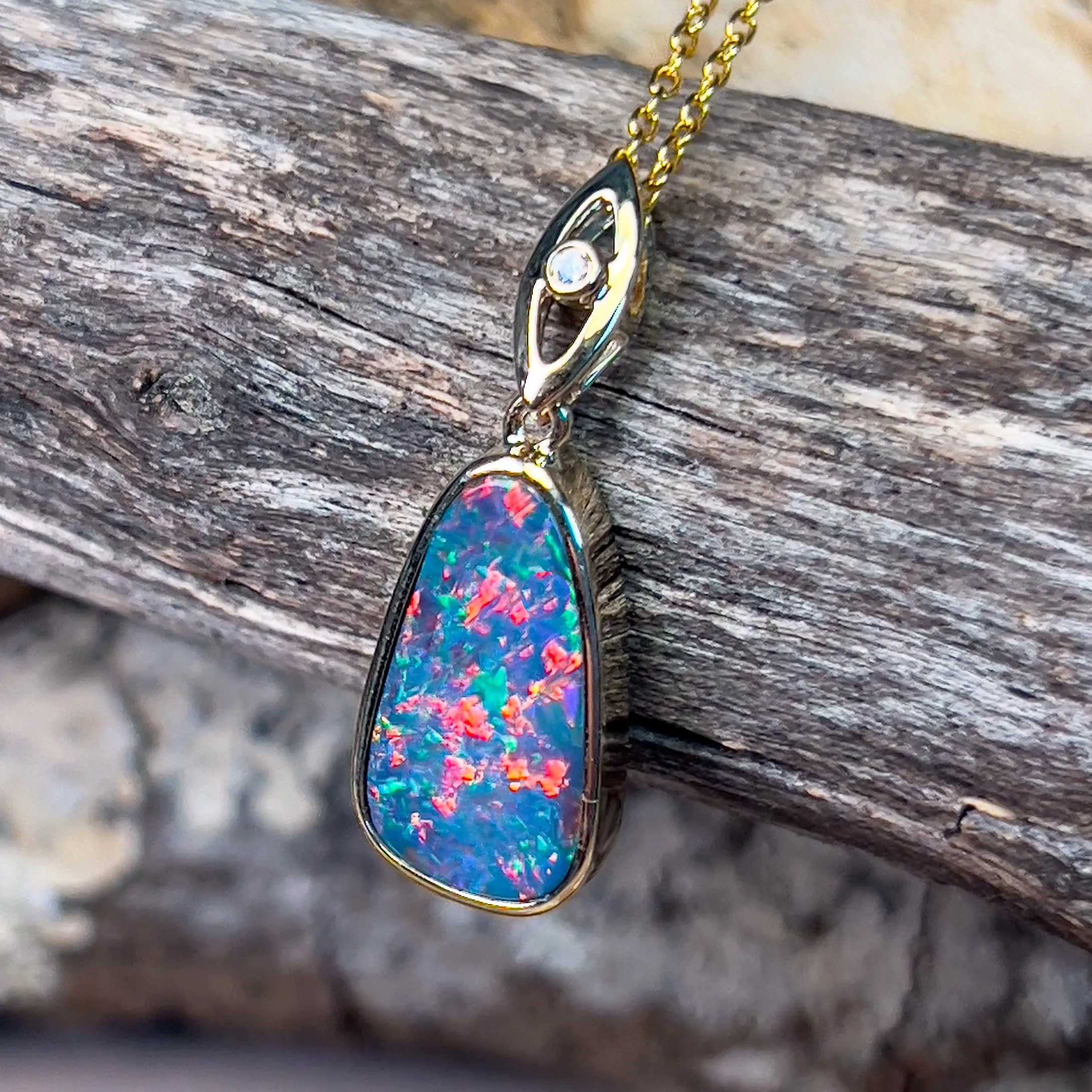 14kt Yellow Gold teardrop shape Opal fire doublet with diamond pendant