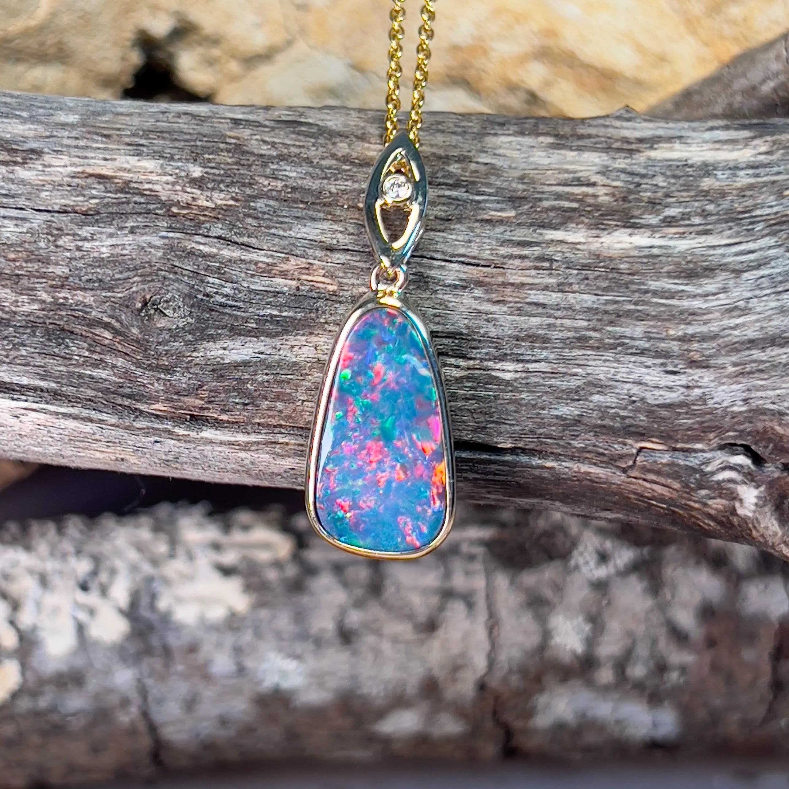 14kt Yellow Gold teardrop shape Opal fire doublet with diamond pendant