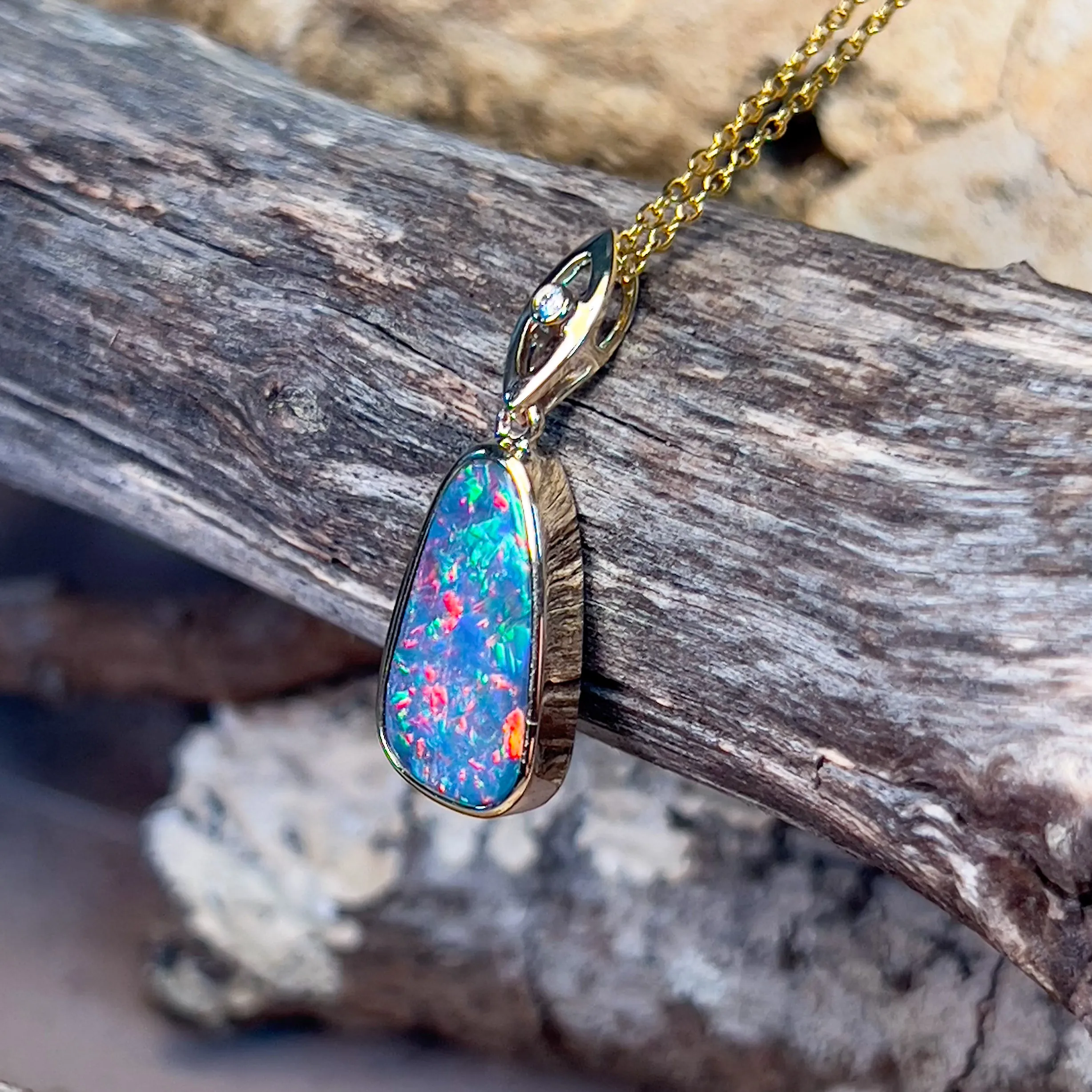 14kt Yellow Gold teardrop shape Opal fire doublet with diamond pendant