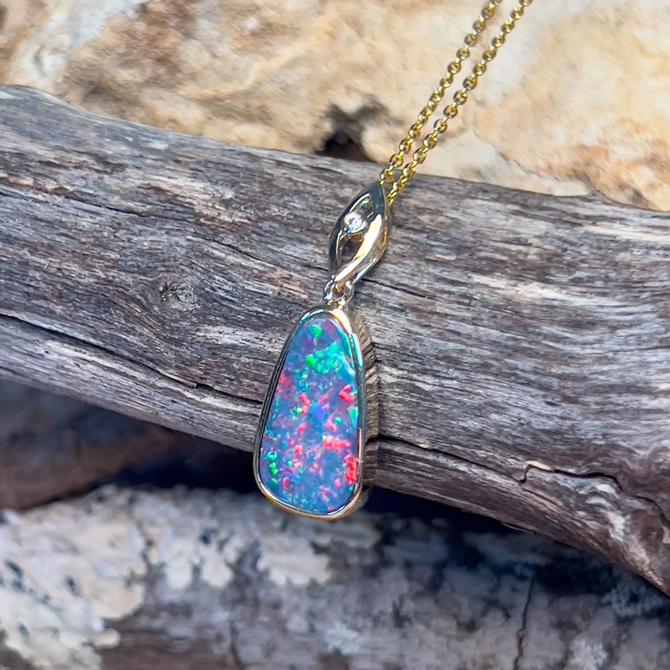 14kt Yellow Gold teardrop shape Opal fire doublet with diamond pendant