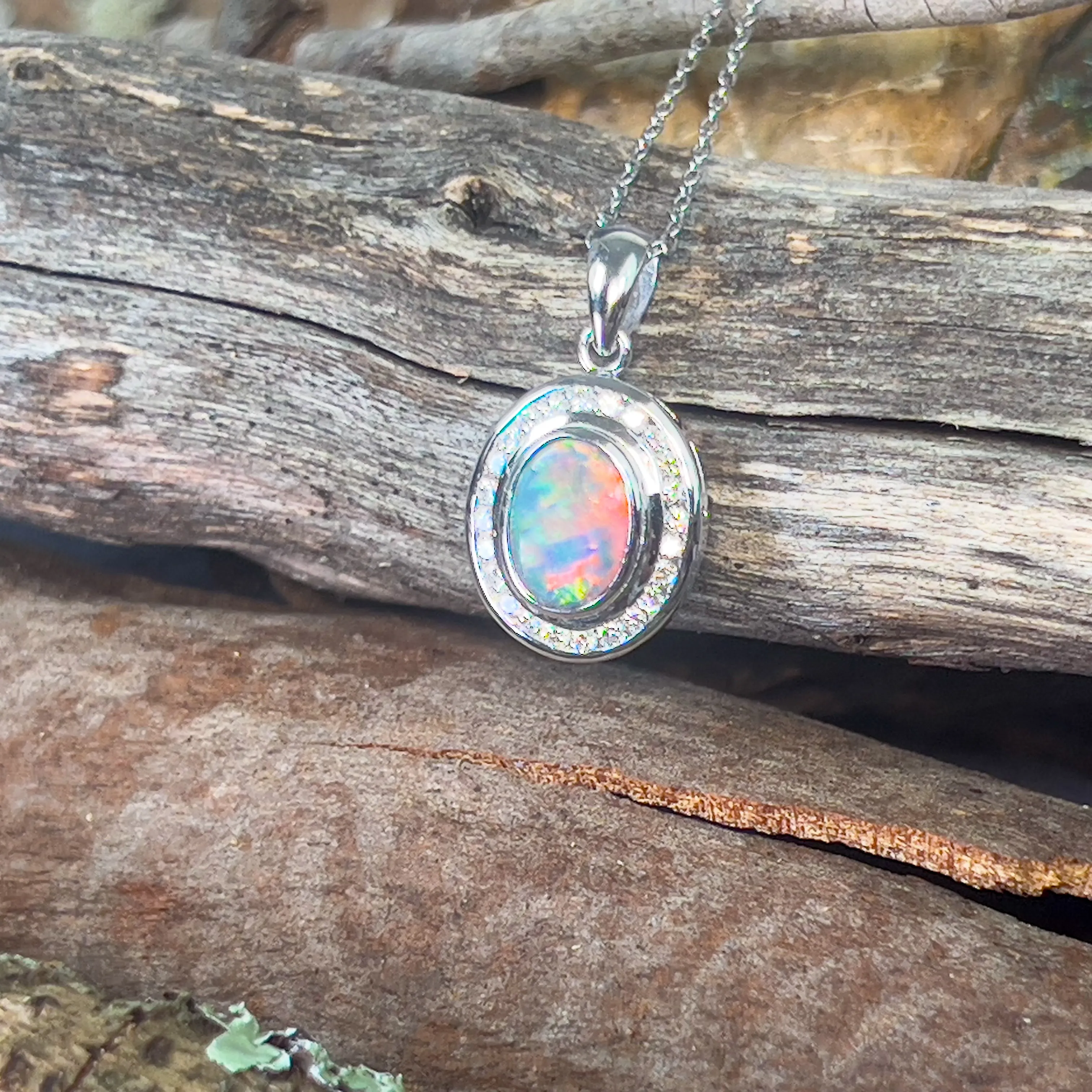 18kt White gold halo Black Opal 1.92ct Red flash pendant with diamonds pendant
