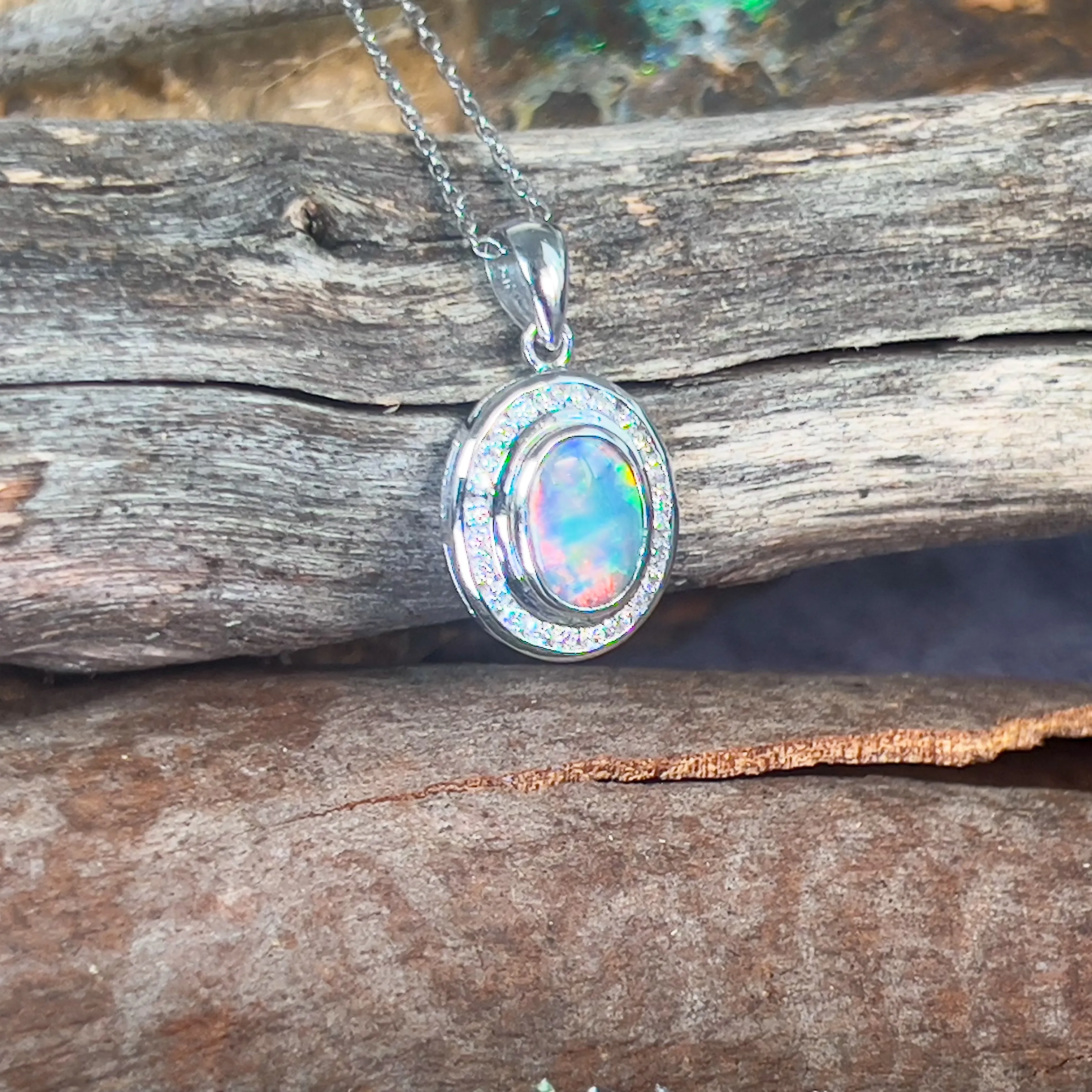 18kt White gold halo Black Opal 1.92ct Red flash pendant with diamonds pendant