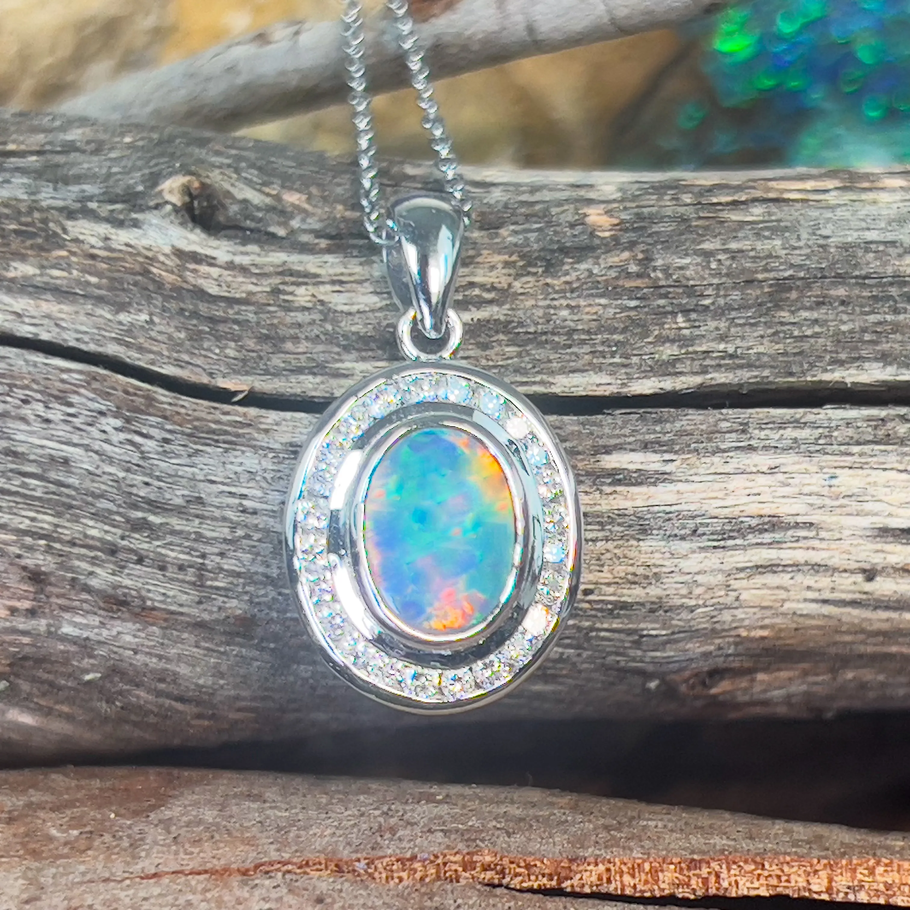 18kt White gold halo Black Opal 1.92ct Red flash pendant with diamonds pendant