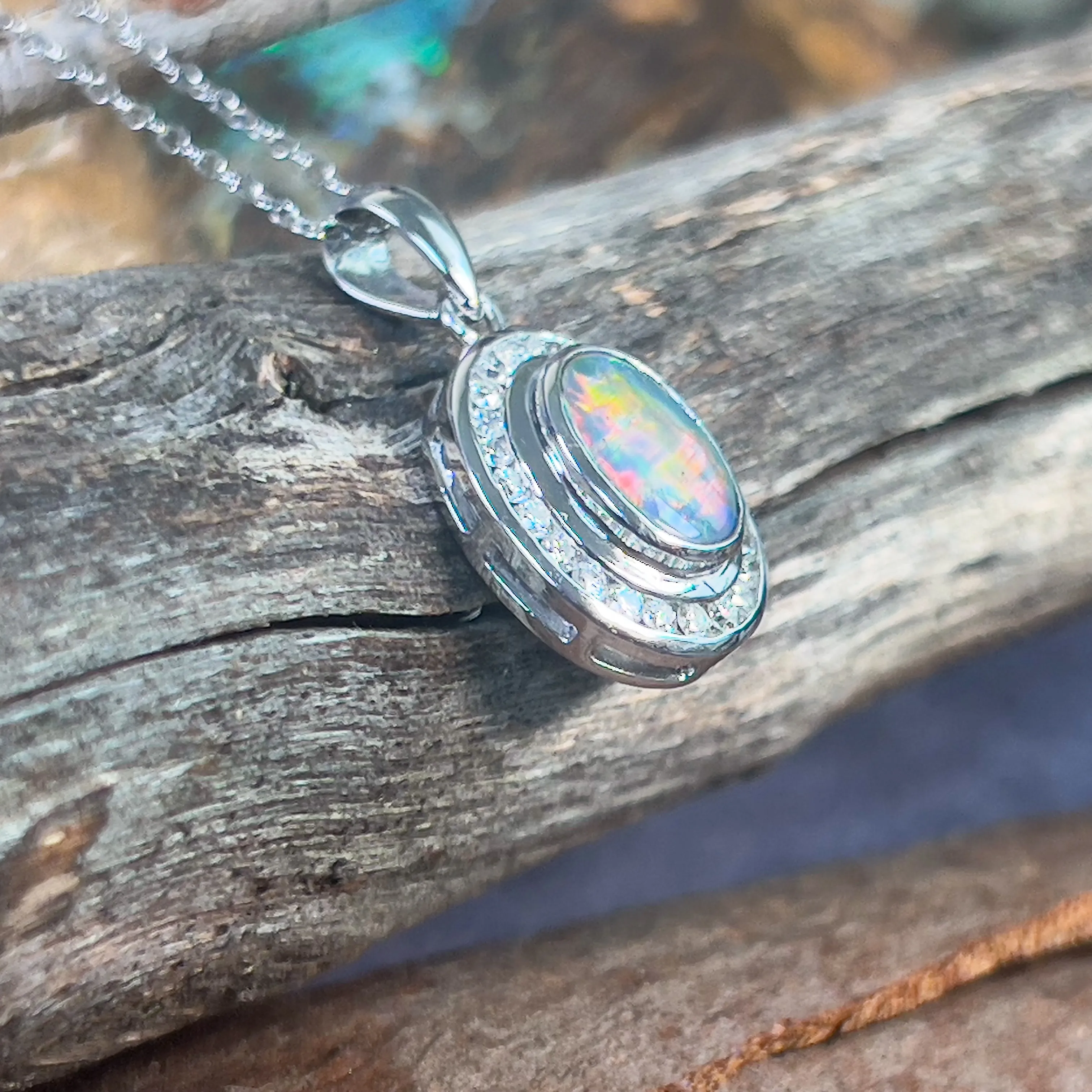 18kt White gold halo Black Opal 1.92ct Red flash pendant with diamonds pendant
