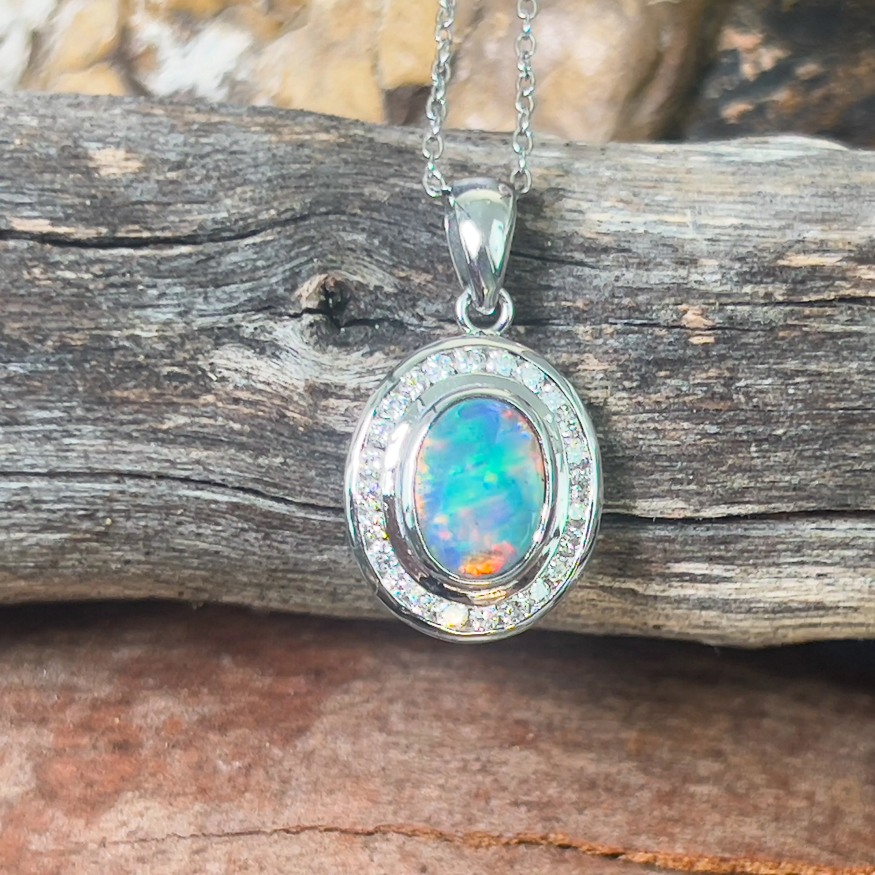 18kt White gold halo Black Opal 1.92ct Red flash pendant with diamonds pendant