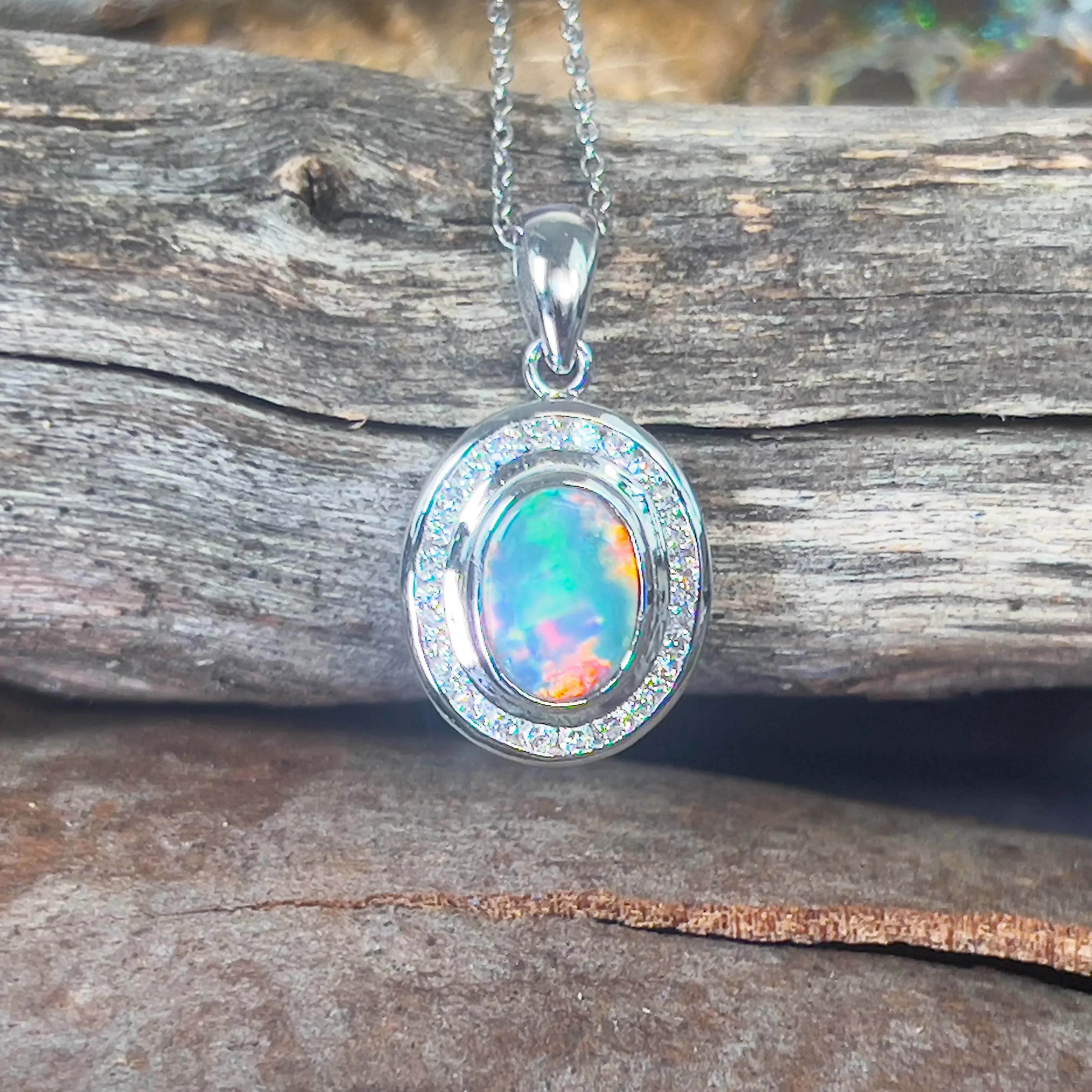 18kt White gold halo Black Opal 1.92ct Red flash pendant with diamonds pendant