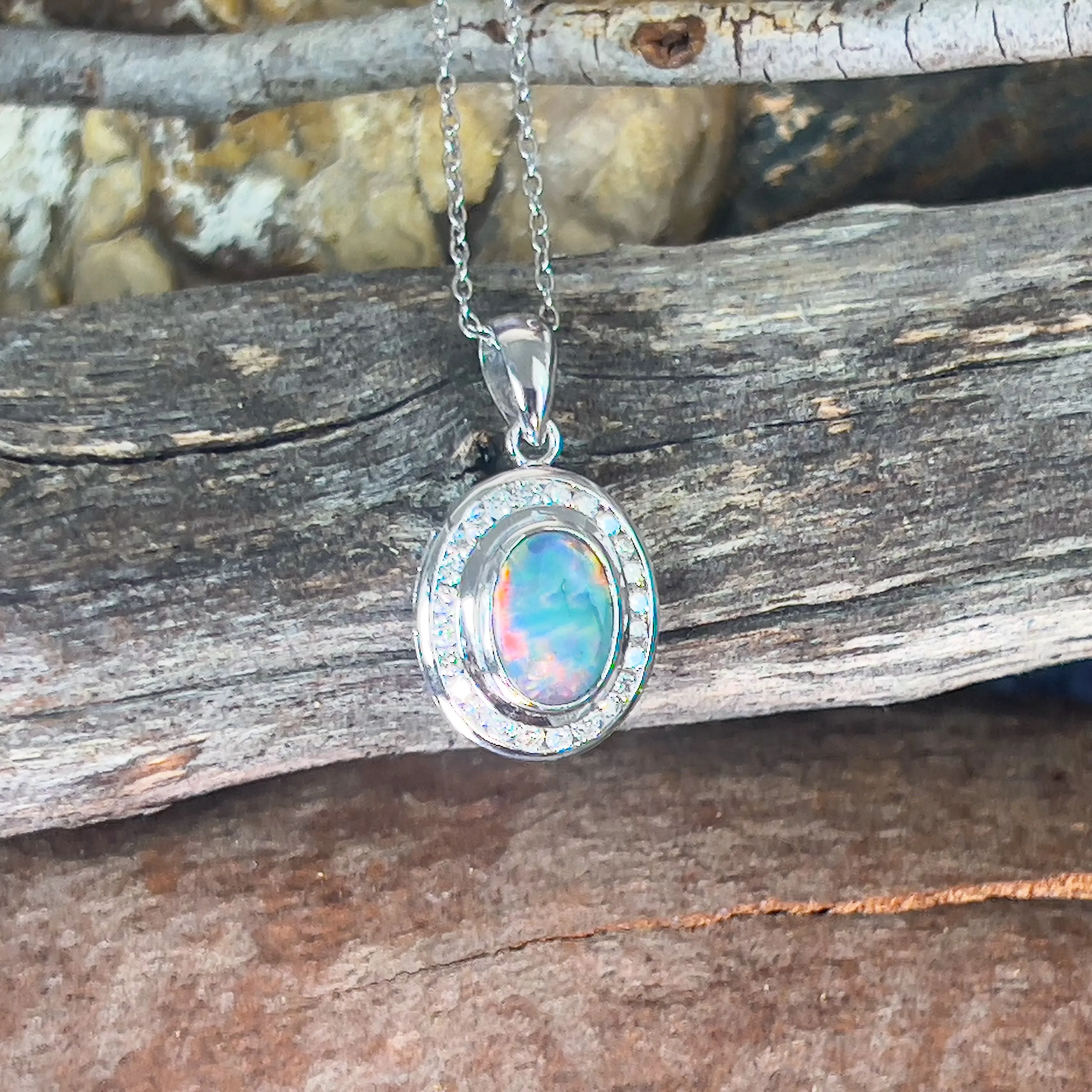 18kt White gold halo Black Opal 1.92ct Red flash pendant with diamonds pendant