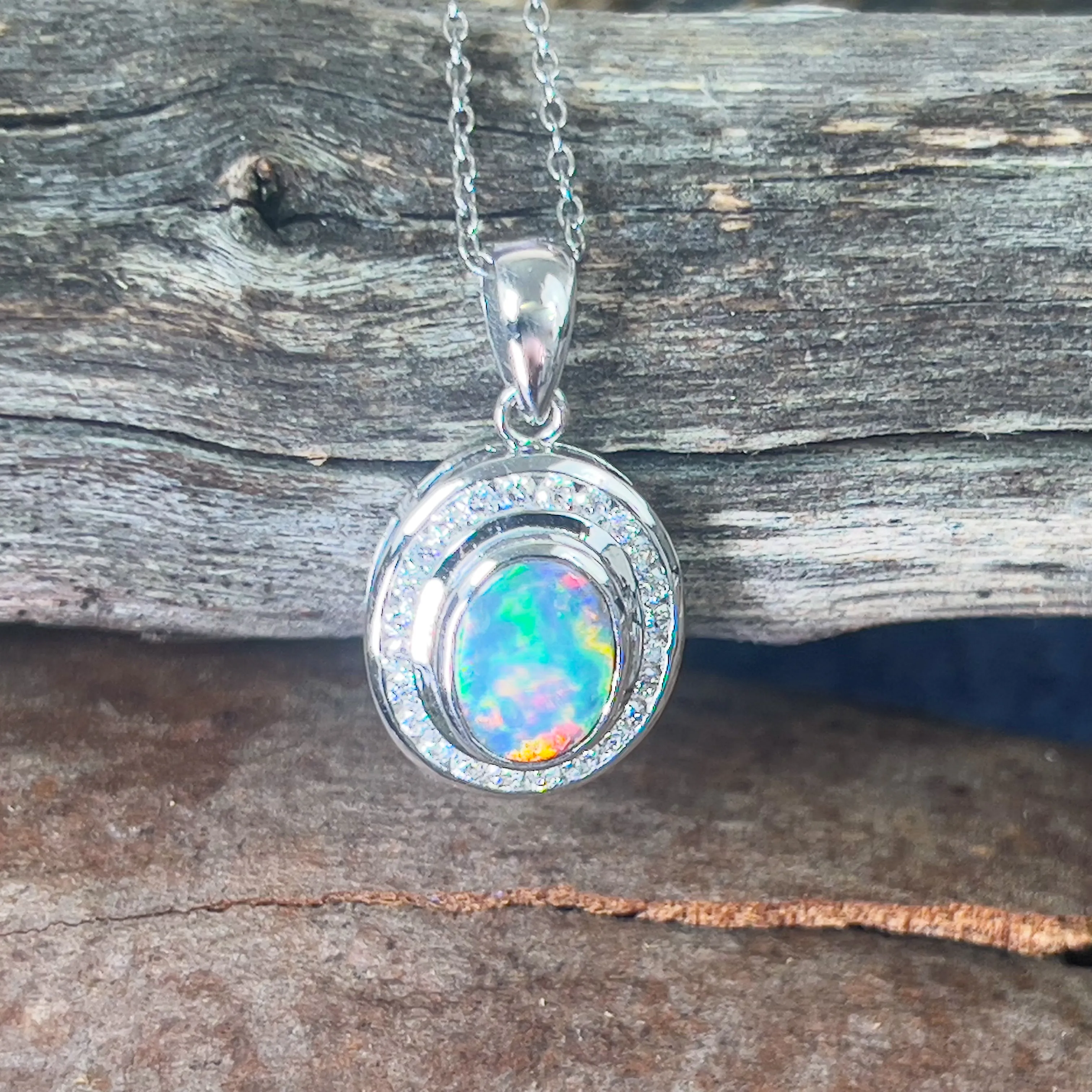 18kt White gold halo Black Opal 1.92ct Red flash pendant with diamonds pendant