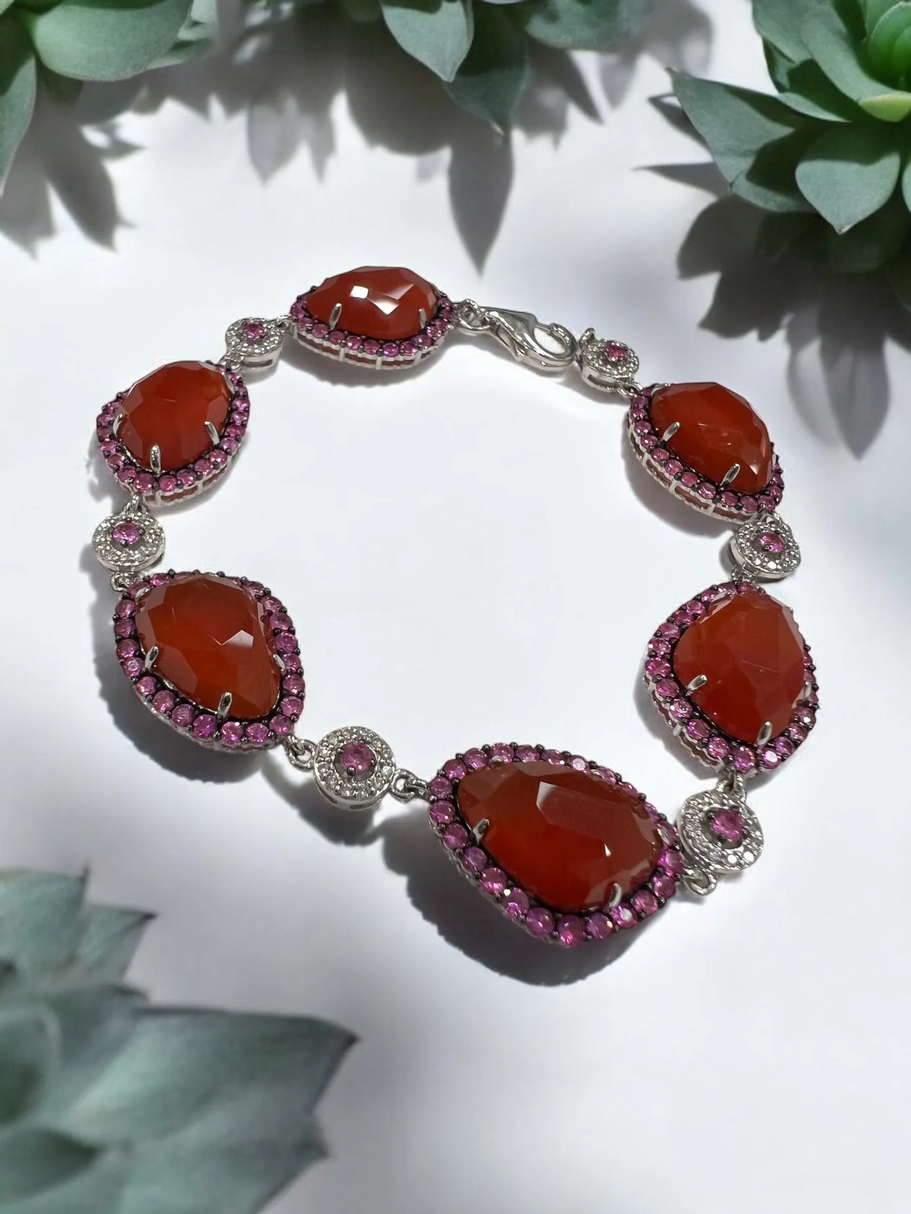 6 carnelians surrounded by hot pink sapphired and diamond bracelet