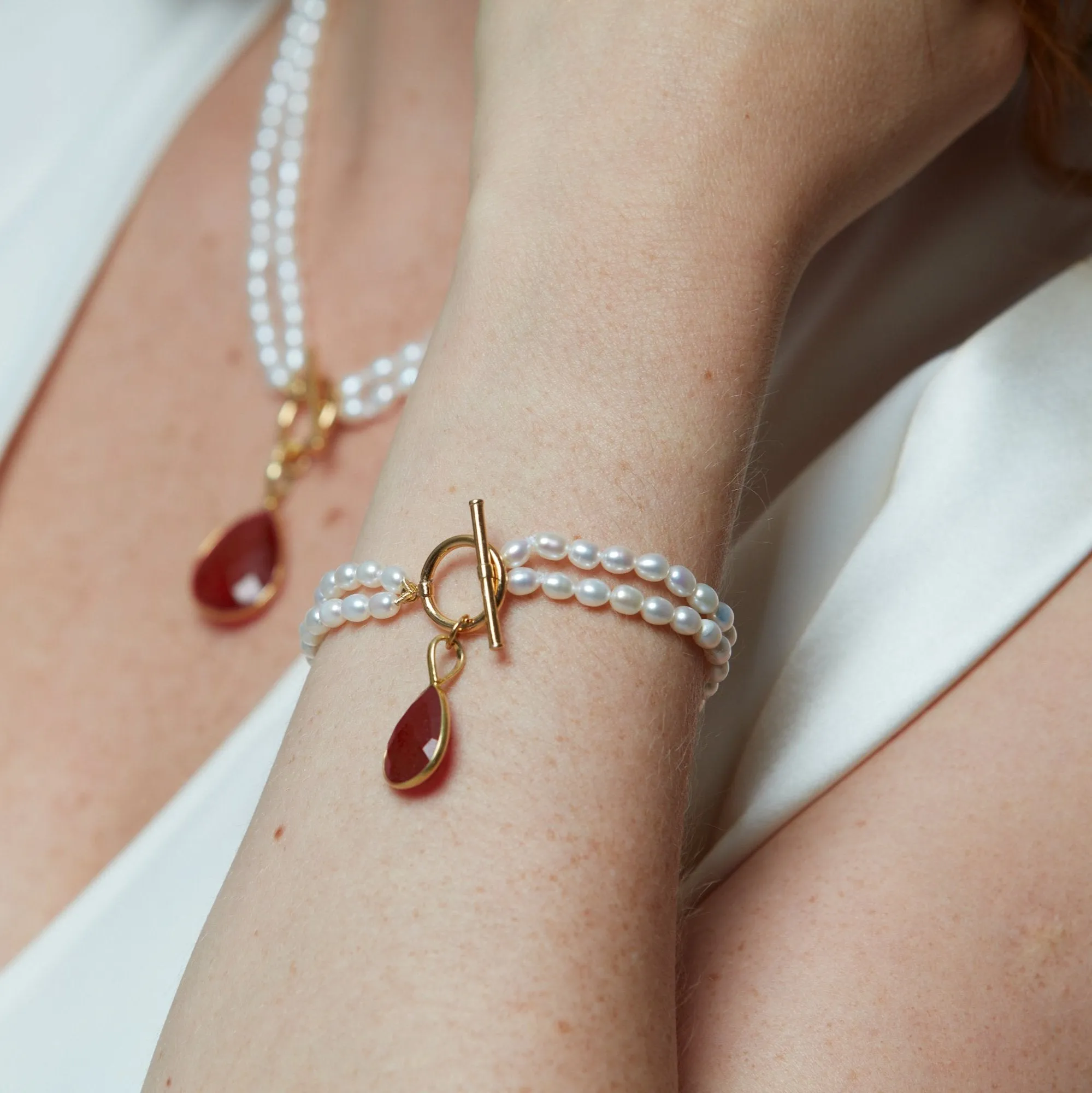Clara double-strand cultured freshwater pearl bracelet with ruby quartz drop pendant