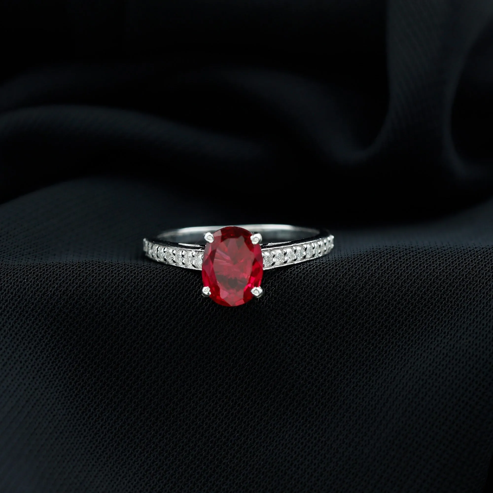 Oval Lab Grown Ruby Solitaire Ring with Moissanite Side Stones