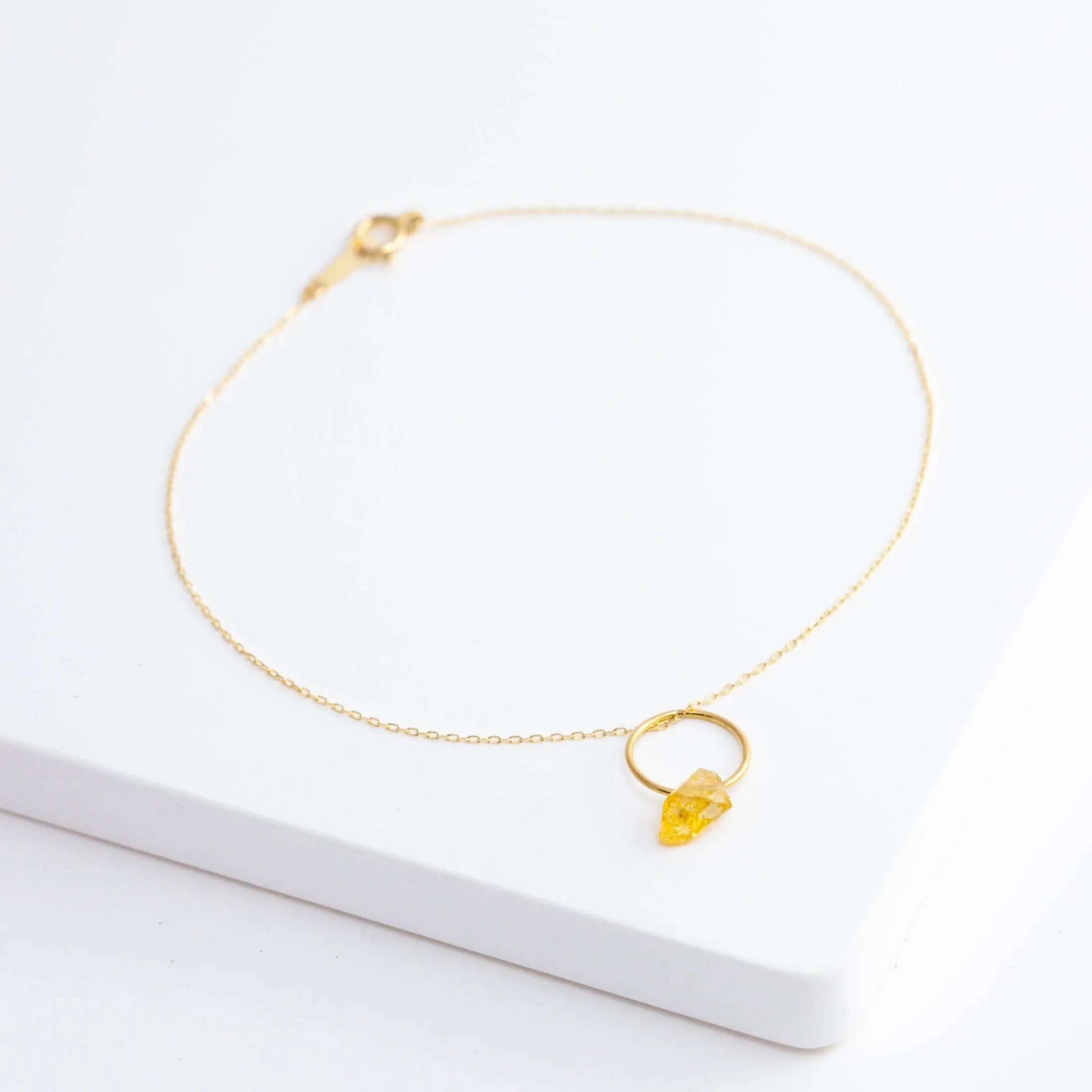 Rough stone gold grossular garnet pendant